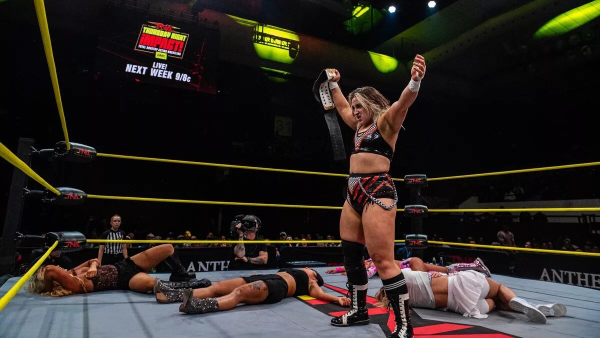 A graphic of Dani Luna posing with the TNA Knockouts World Championship on the January 8 episode of TNA iMPACT