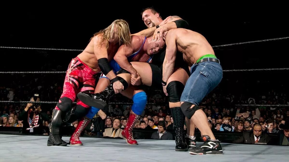 Chris JEricho, John Cena and Kurt Angle trying to eliminayte the Big Show at Royal Rumble 2004
