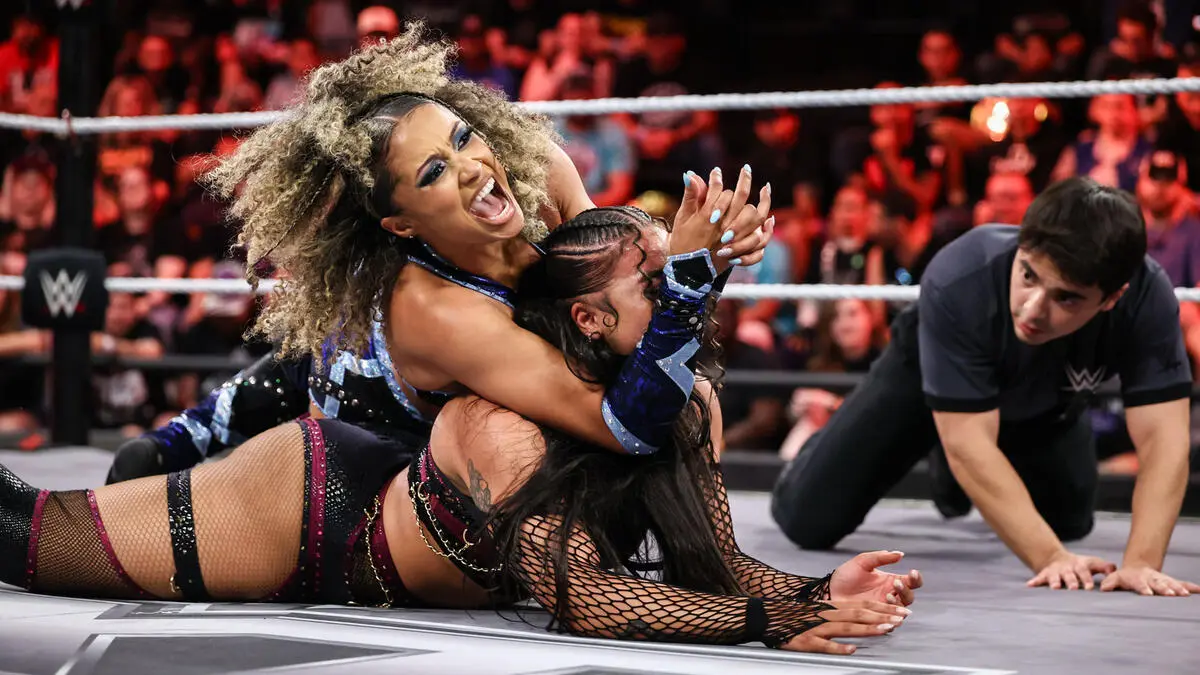 A graphic of Kelani Jordan and Jaida Parker as they faced on NXT Revenge Week One