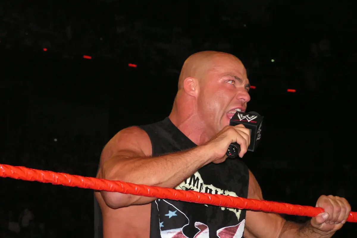 WWE legend Kurt Angle in the ring in 2024 cutting a promo on the microphone.