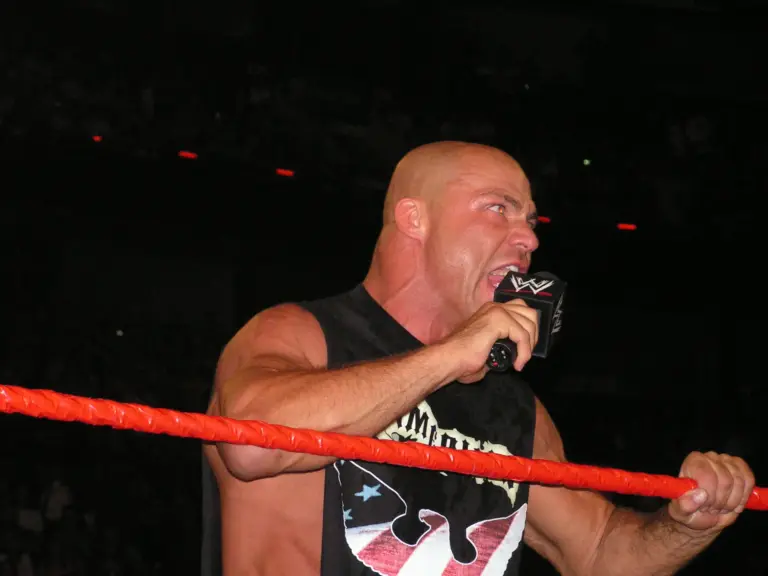 WWE legend Kurt Angle in the ring in 2024 cutting a promo on the microphone.