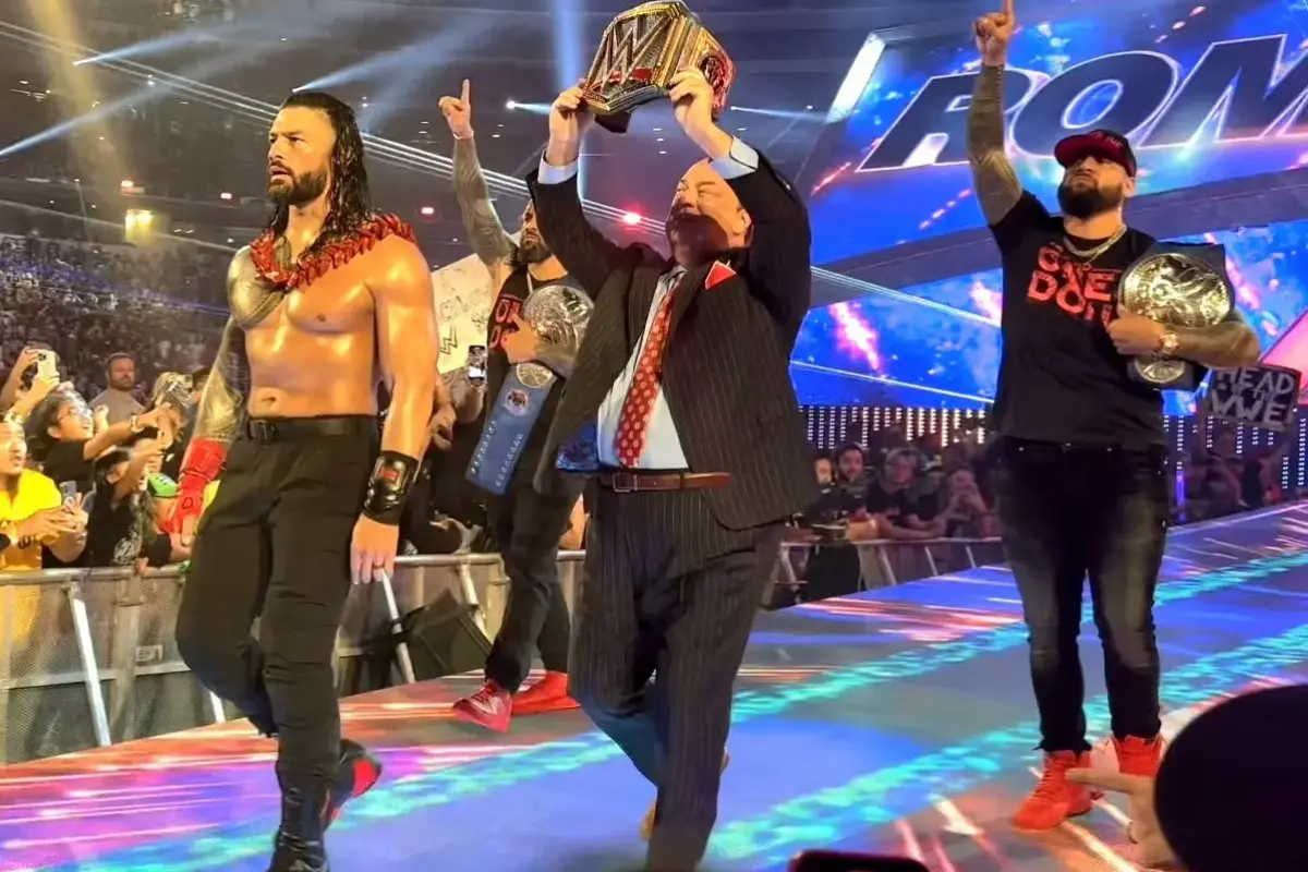 Legendary WWE faction The Bloodline with Roman Reigns and Paul Heyman at the front and The Usos in the back walking to the ring into SummerSlam 2022.