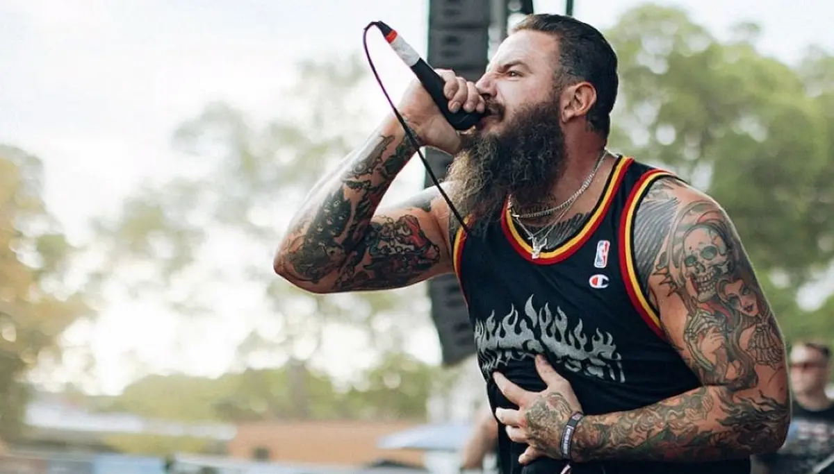 A graphic of Brody King singing with his band God's Hate