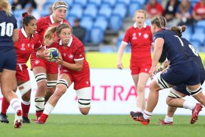 Rugby Canada women's team player, Sophie de Goede, runs the ball forward against New Zealand at the Waikatere Trusts Stadium