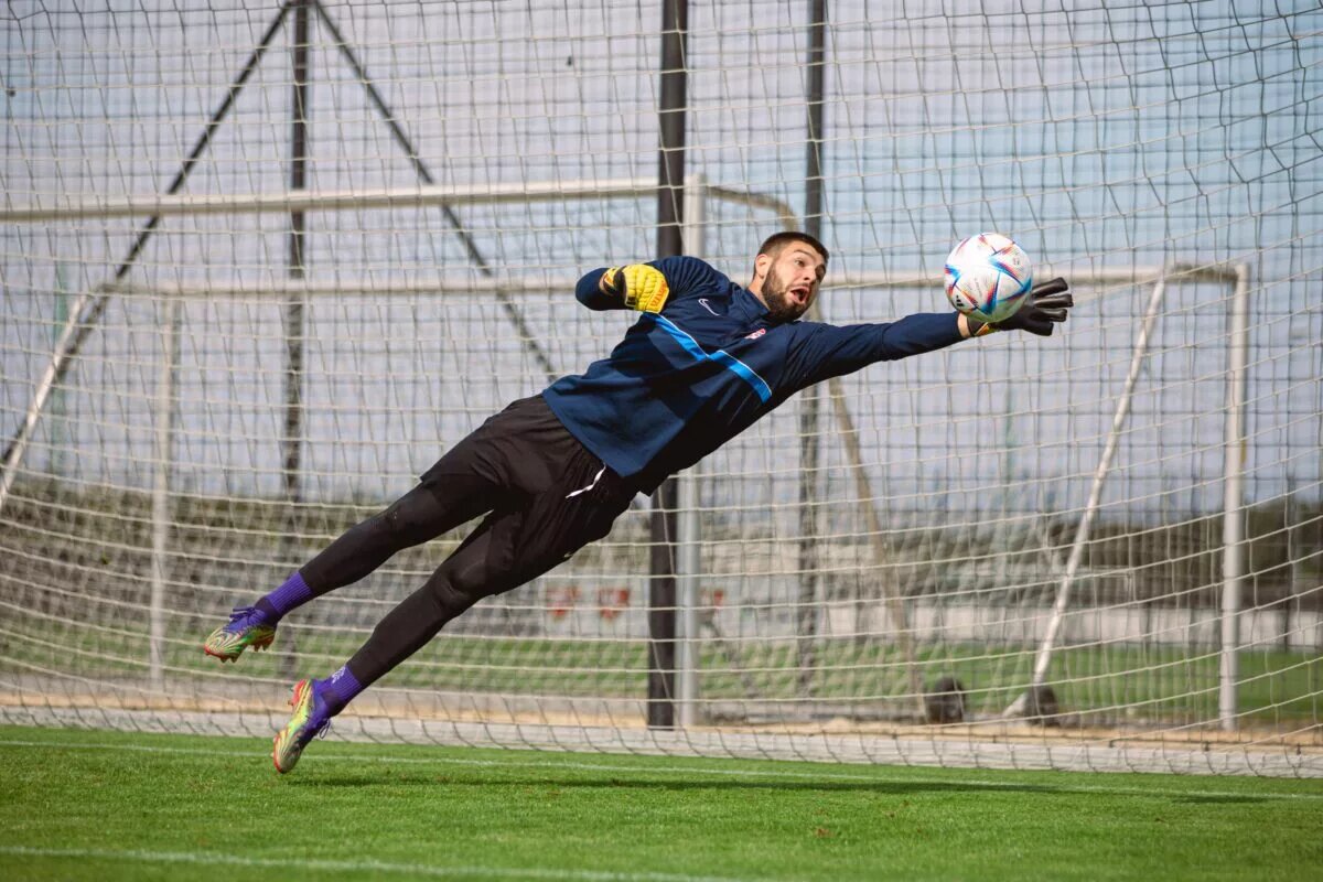 Maxime Crépeau, Canadian men's soccer team goalkeeper, makes a terrific save in preparation for Uruguay