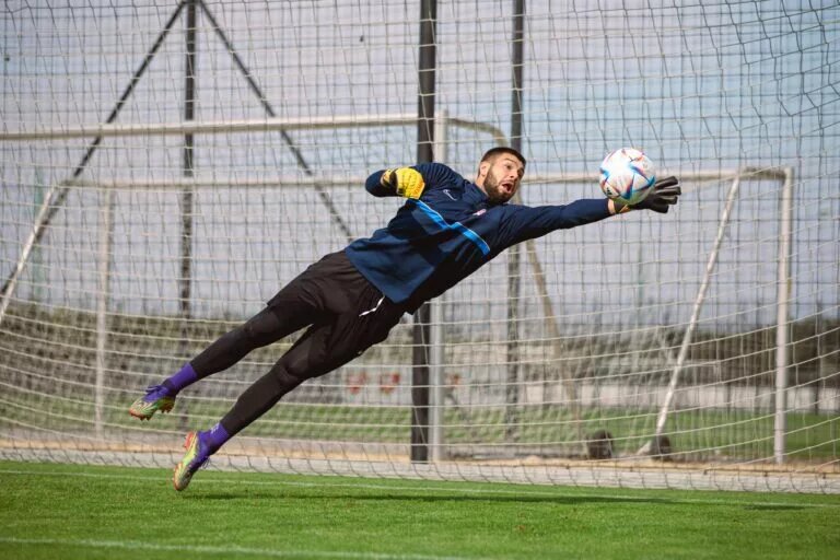 Maxime Crépeau, Canadian men's soccer team goalkeeper, makes a terrific save in preparation for Uruguay
