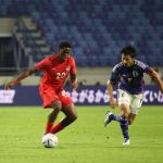 CanMNT forward Jonathan David with the ball as the CanMNT edges Japan at Al Maktoum Stadium