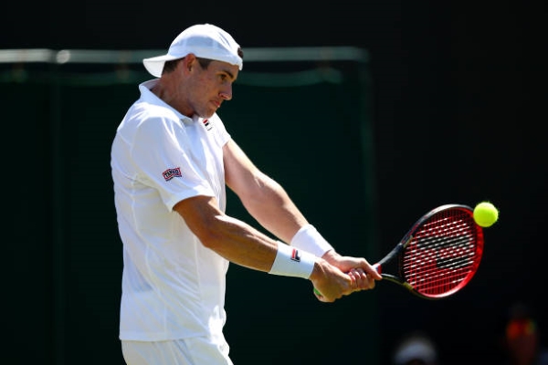 John Isner in action at Wimbledon in 2019.