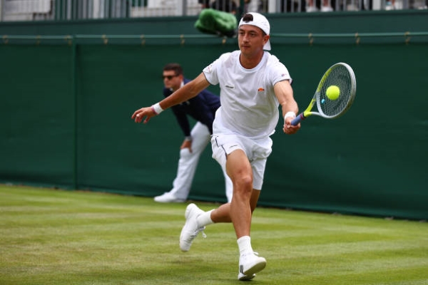 Ryan Peniston in action at Wimbledon.