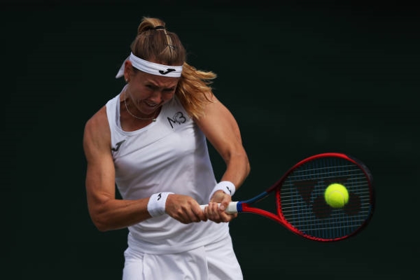 Marie Bouzkova in action at Wimbledon.