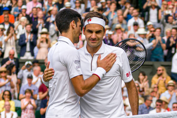 Novak Djokovic and Roger Federer at the conclusion of the 2019 Wimbledon final.