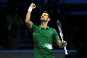 Novak Djokovic celebrates his win over Stefanos Tsitsipas.