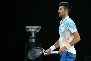Novak Djokovic 2023 Australian Open Final with trophy in background