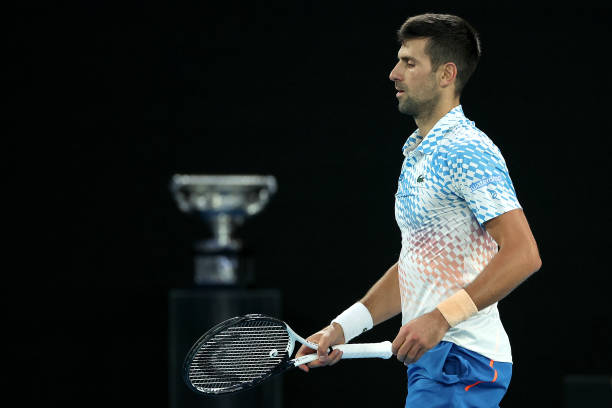 Novak Djokovic 2023 Australian Open Final with trophy in background