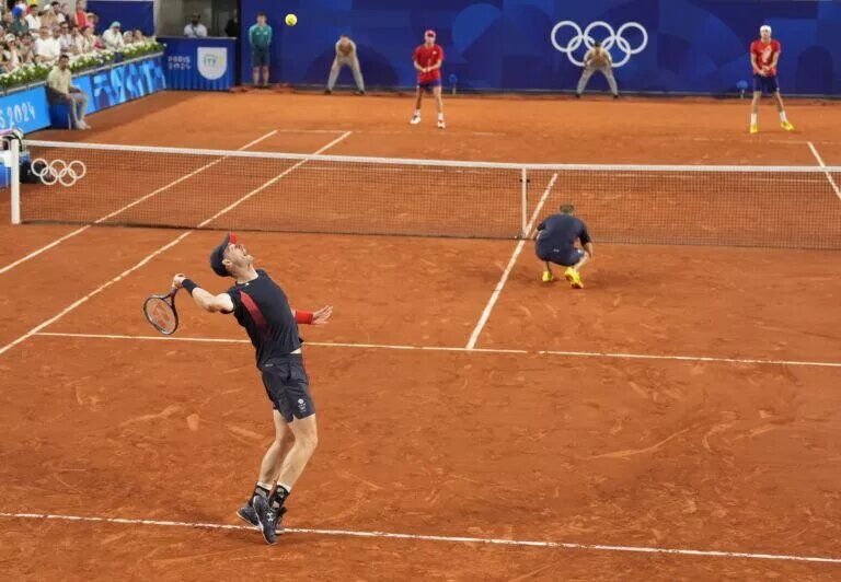 Andy Murray and Dan Evans in action for Great Britain.
