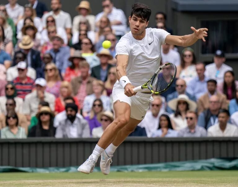 Carlos Alcaraz in action at Wimbledon.